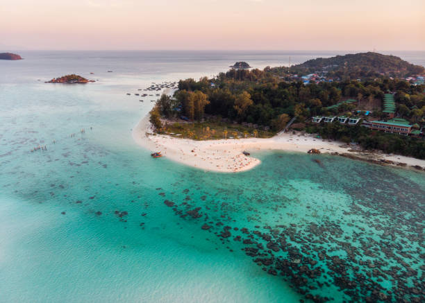 istock White beach with coral reef in tropical sea 1137370531