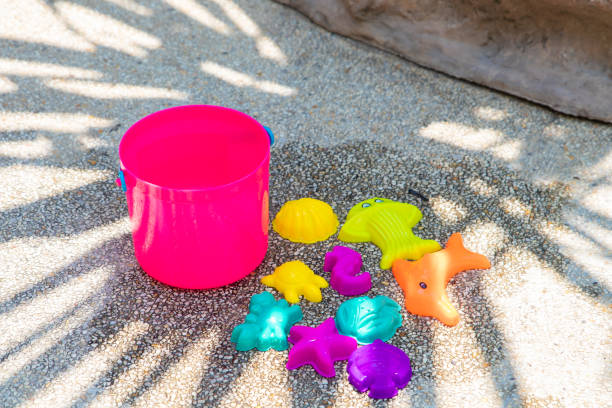 istock childrens beach bright pink toys on a sandy concrete background 1137372117
