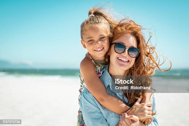 Mother With Daughter At Beach Stock Photo - Download Image Now - Beach, Family, Summer