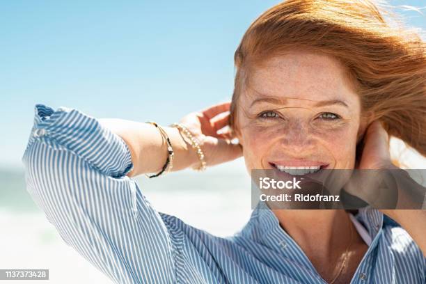 Smiling Mature Woman At Beach Stock Photo - Download Image Now - Women, One Woman Only, Skin