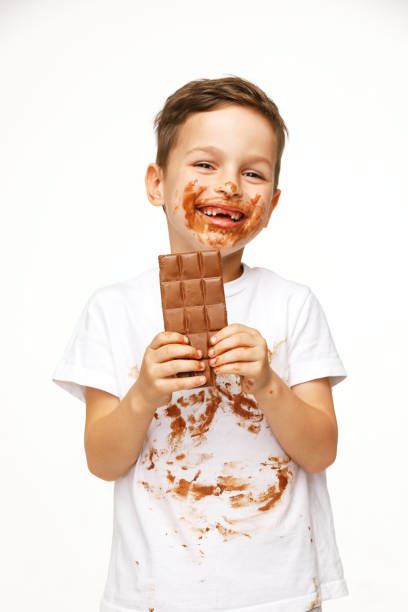 istock little messy boy is eating chocolate studio shot 1137373449