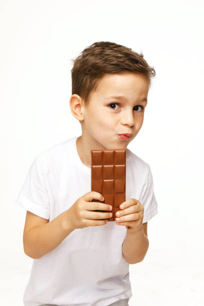 istock little beautiful boy holding chocolate studio shot 1137373777