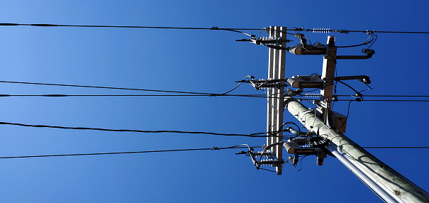 Horizontal Image of Power Lines and Diagonal View of Electricity Pylon