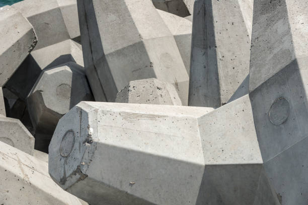Concrete tetrapod structure walls at the beach - monochrome abstract
