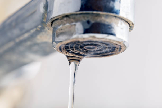 Old faucet with drop, extreme close up