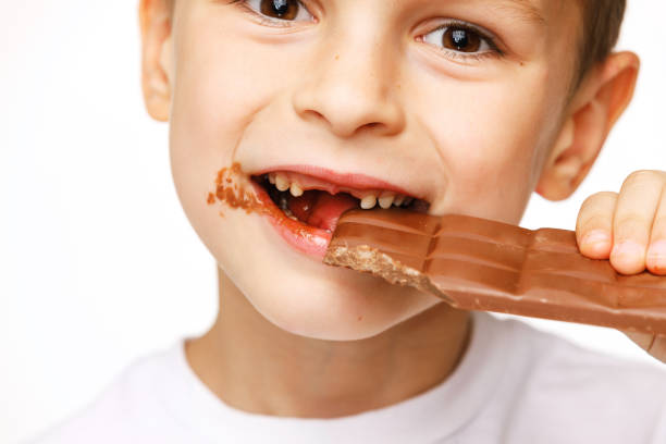 Little girl eating chocolate