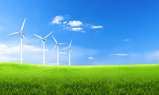Renewable energy with wind turbines green hills. Ecology environmental background for presentations and websites. Beautiful summer wallpaper. Landscape with hills and wind turbines.