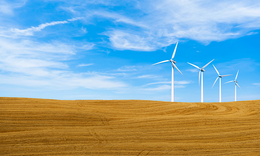 Renewable energy with wind turbines. Wind turbine in hill. Ecology environmental background for presentations and websites. Concept clean energy power in nature. Photo stock