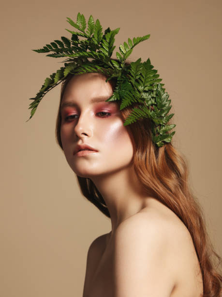 istock Beautiful young woman and leaves 1137378575
