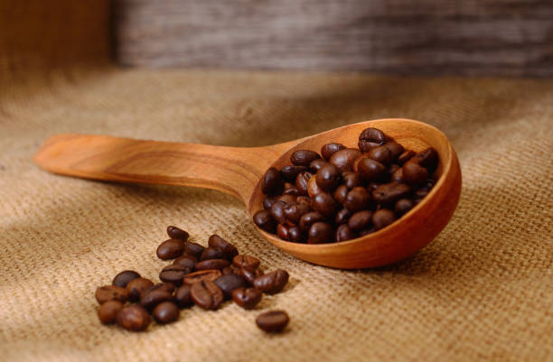 istock Coffee beans in a wooden scoop. 1137379832