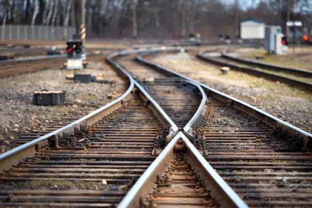 Large empty railroad fork. Concept of industrial logistic and transportation background with selected focus on center point and copy space.