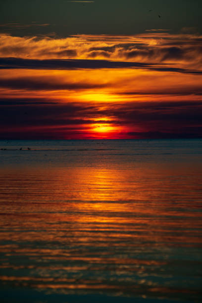 istock calm sunset with no wind on the lake 1137380918