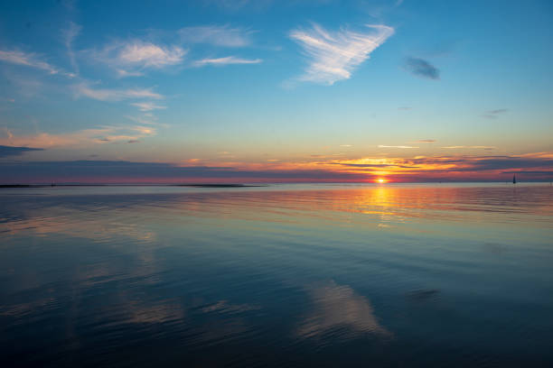 istock calm sunset with no wind on the lake 1137380925