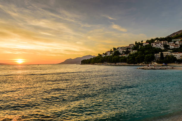 Beautiful sunset at the sea. Tourist village Baška Voda, Dalmatia region, Croatia