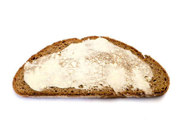panino con burro isolato su sfondo bianco - cheese loaf foto e immagini stock