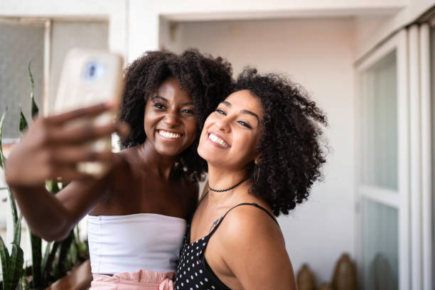 istock Couple or Friends taking a selfie at home 1137386057