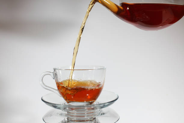 istock Pouring tea to a teacup. 1137386823