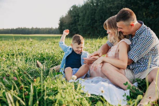 istock Parents and little son on vacation playing together 1137389753