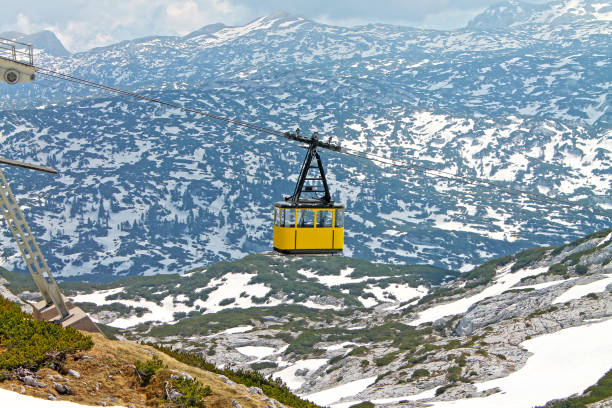 View of cable railway with yellow cab. Krippenstein mount, Dachstein,Obertraun, Austria.