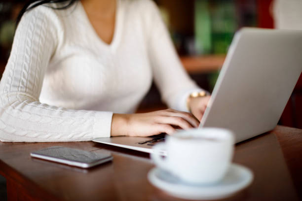 istock Woman working on laptop at a cafe 1137392509