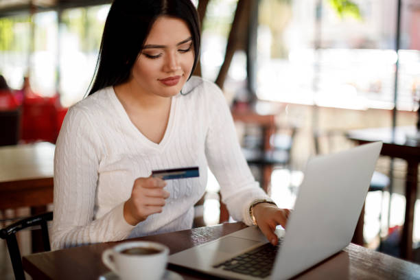 istock Young woman shopping online 1137393285