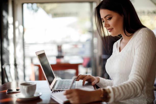 istock Young woman working at a cafe 1137393534