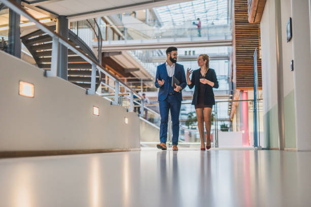istock Two young business people making strategi. 1137394287