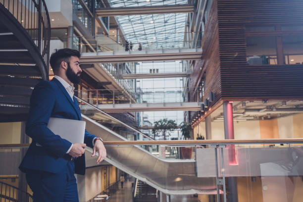 istock Business man holding laptop. 1137394820