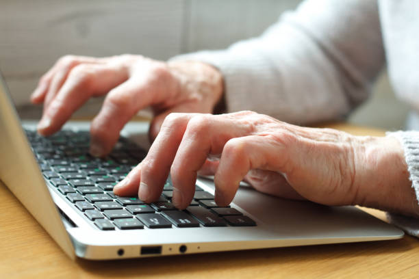 istock Senior elderly business woman working on laptop. 1137394936