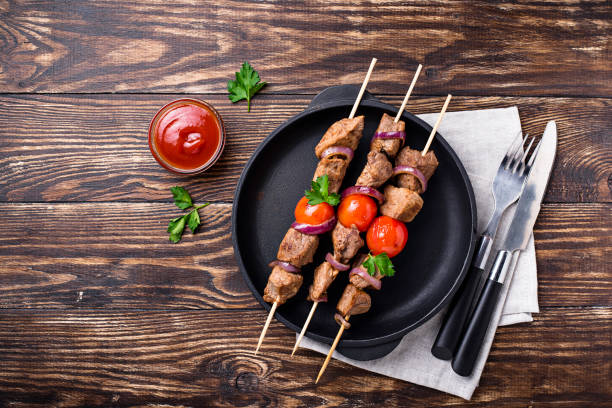 istock Grilled shish kebab skewers  with tomatoes 1137396238
