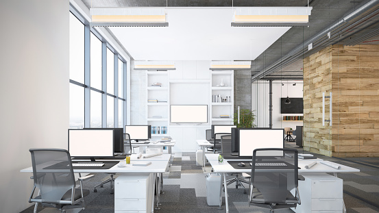 Modern open plan office interior. Office desks with computers, office chairs, electric lamps and digital equipment. Template for copy space. Render.