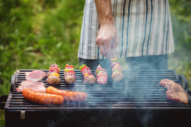 istock Preparing barbecue outdoors in the nature 1137400301