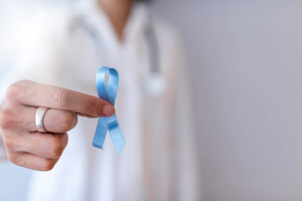 istock Blue ribbon in doctor hand. 1137400655