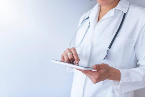 istock Young doctor using digital tablet against dental equipment. 1137400930