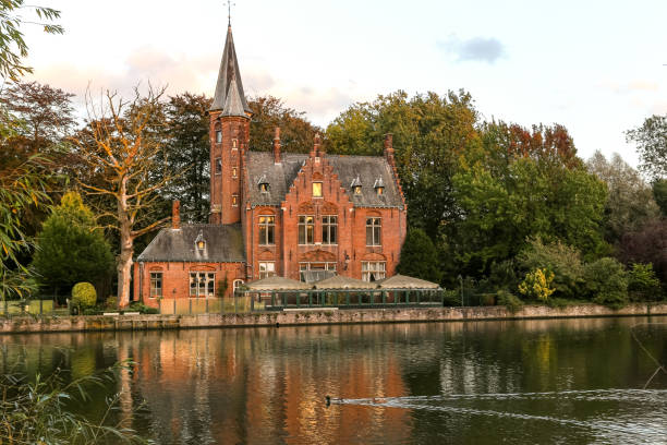 Bruges, Belgium - October 9, 2014: An old belgian castle along the canal in Bruges, Belgium, Europe