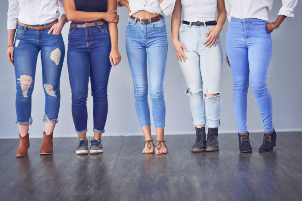 Beauty comes in all shapes and sizes Studio shot of a group of attractive young women posing together against a gray background jeans stock pictures, royalty-free photos & images
