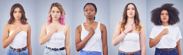 I pledge allegiance to the sisterhood Studio shot of a group of attractive young women posing together against a gray background sorority photos stock pictures, royalty-free photos & images