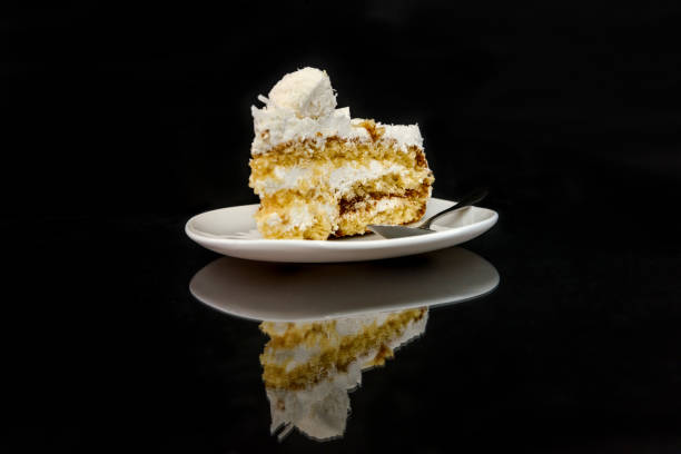 istock Piece of tasty cake on plate with reflection 1137406240
