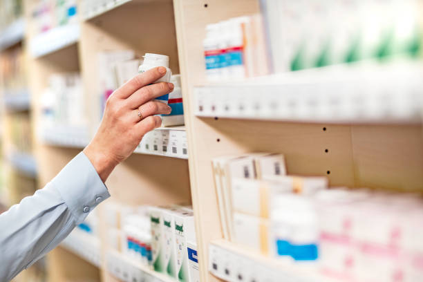 istock Woman holding pill bottle 1137407495