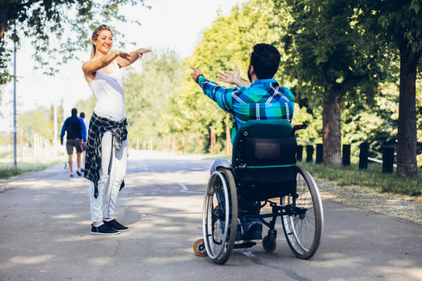 istock Paraplegic with her girlfriend on track in an open park 1137411456