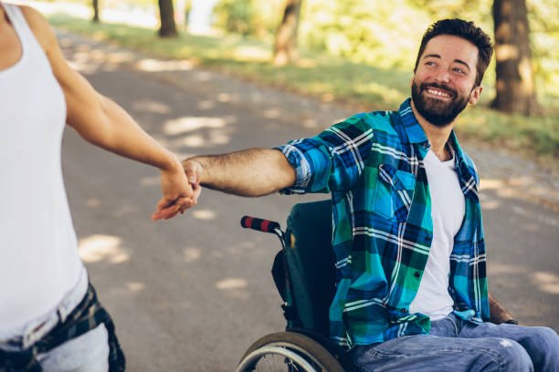 istock Paraplegic with her girlfriend on track in an open park 1137411647
