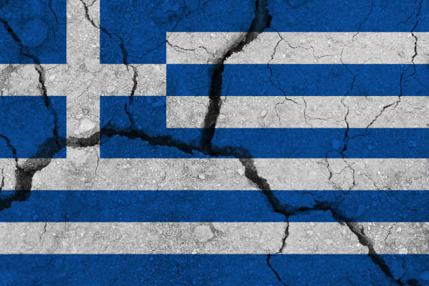 Greece flag on the cracked earth. National flag of Greece. Earthquake or drought concept