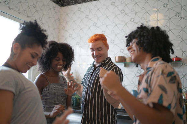 istock Friends dancing and having fun at kitchen 1137414056