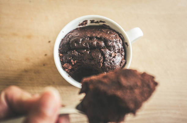 Brownie cake in a mug, chocolate mug cake stock photo
