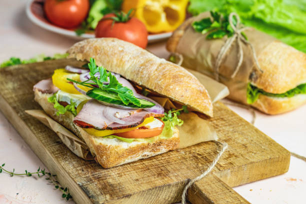 istock Sandwich with ham, tomato, cheese, pepper, onion and salad 1137415875