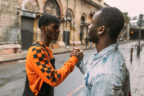 Generation Z - African ethnicity youth handshake - United Kingdom