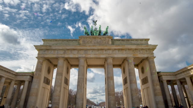 Time lapse. Brandenburg Gate or Brandenburger Tor in Berlin, Germany is a famous national landmark and tourist attraction at Unter den Linden, in the Mitte part of the German capitol City