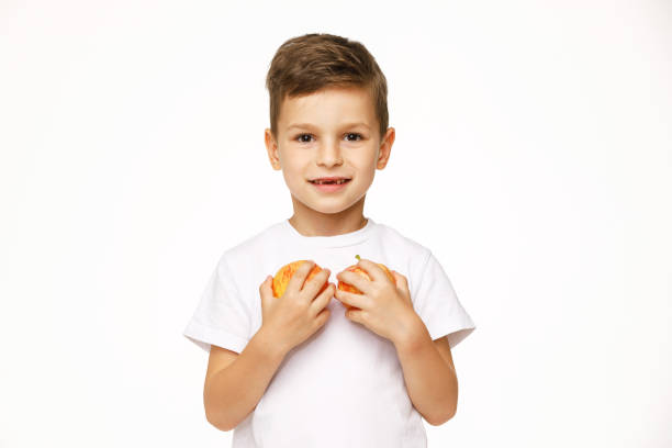 little boy is holding  apples studio sho - studio sho imagens e fotografias de stock