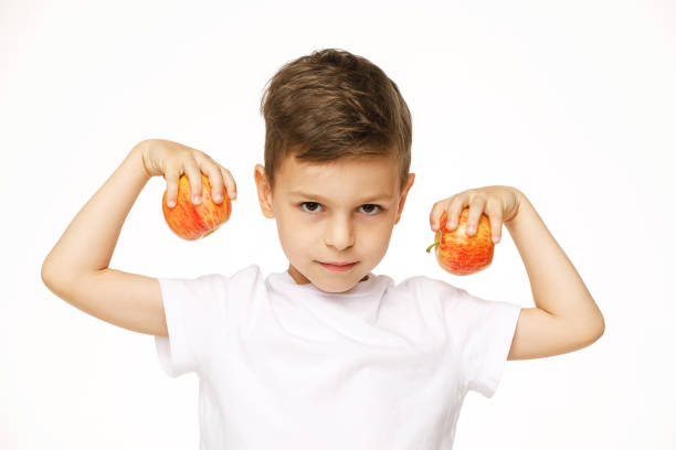 little boy is holding  apples studio sho - studio sho imagens e fotografias de stock