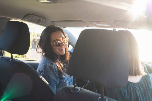 istock young women travel by car, view from behind 1137425321